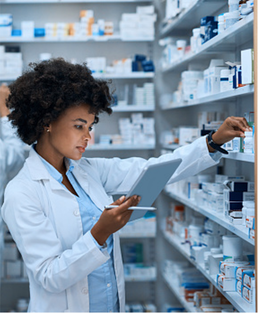 Pharmacist reaching for medication to be dispensed in a pharmacy